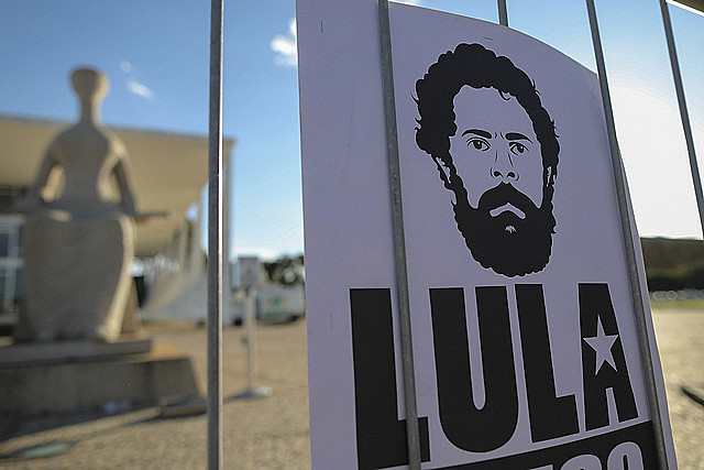 A sign with a drawing of ex-president Lula during a protest calling for his freedom in Brazil's capital city, Brasília