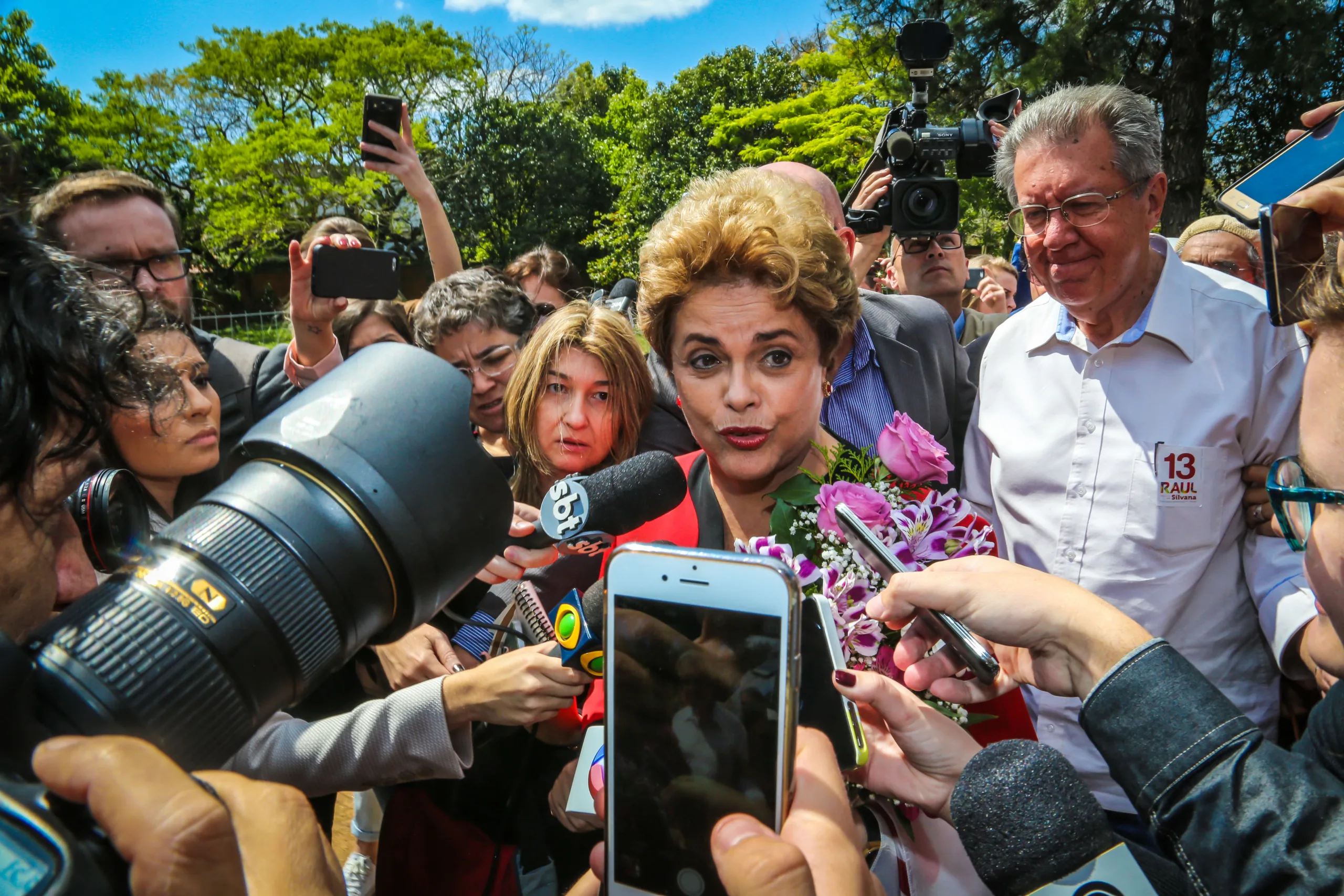 Brazilian former president Dilma Rousseff, from the leftist Workers' Party (PT), arrives at a polling station in Porto Alegre, in the Brazilian state of Rio Grande do Sul, during municipal elections on October 2, 2016. Brazilians furious at recession and corruption voted Sunday in municipal elections amid heightened security after a series of murders of candidates. Among the first to cast his ballot in the financial capital Sao Paulo was Brazilian president Michel Temer from the center-left PMDB party, who took over the presidency in August after turning on his former leftist ally Dilma Rousseff and helping to force her from the top job in an impeachment vote. (Photo by Gustavo ROTH / AFP)
