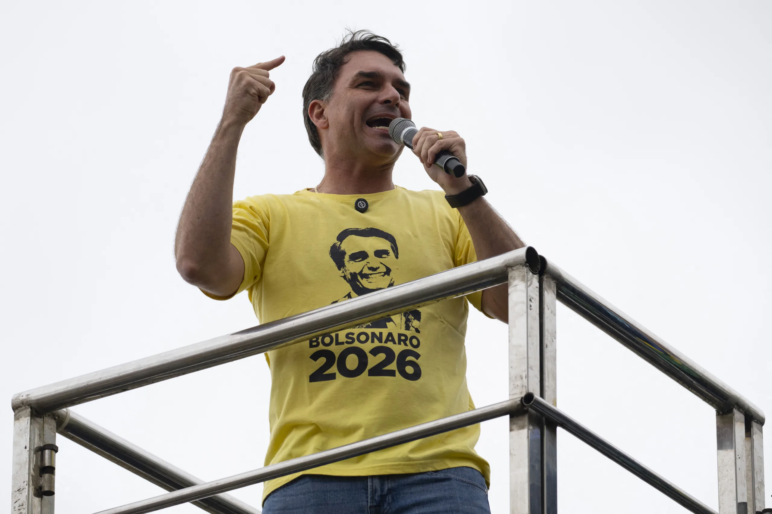 (FILES) Brazil's senator Flavio Bolsonaro, son of Brazil's former president (2019-2022) Jair Bolsonaro, on trial for his alleged role in an attempted coup, delivers a speech in a demonstration during Independence Day, at Copacabana beach in Rio de Janeiro, Brazil on September 7, 2025. Even Flavio Bolsonaro didn't seem to take his presidential candidacy very seriously when his father, Brazil's former president Jair Bolsonaro, tapped him as his political heir from behind bars. However the bespectacled 44-year-old senator, who is pitching himself as a more moderate member of the far-right dynasty, surprised many with a surge in opinion polls ahead of the October 2026 elections. (Photo by Pablo PORCIUNCULA / AFP)