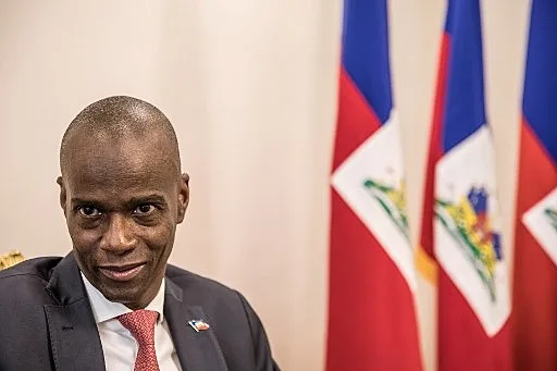 President Jovenel Moise sits at the Presidential Palace during an interview with AFP in Port-au-Prince, October 22, 2019. - Haitians fed up with poverty and miserable living conditions call him corrupt and incompetent, and want him to resign. But in an interview with AFP President Jovenel Moise is evasive about yielding and offers only vague ideas for making things better for his countrymen. The poorest country in the Americas has been roiled for two months by violent protests that were triggered by fuel shortages.They have now morphed into a broader campaign against the president, who come to power in 2017 in an election that some called fraudulent. (Photo by Valerie Baeriswyl / AFP)